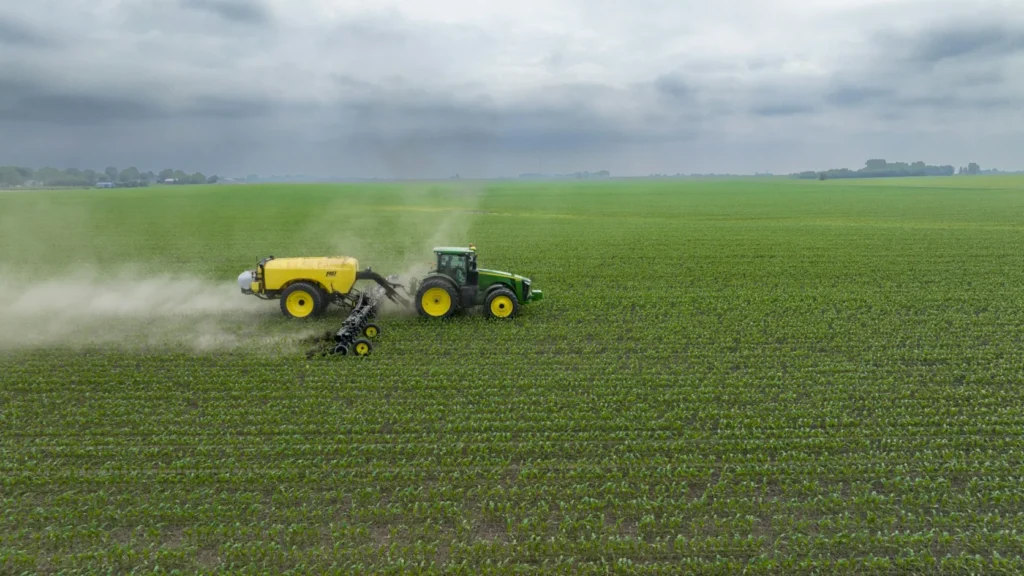 Tractor working a field at harvest